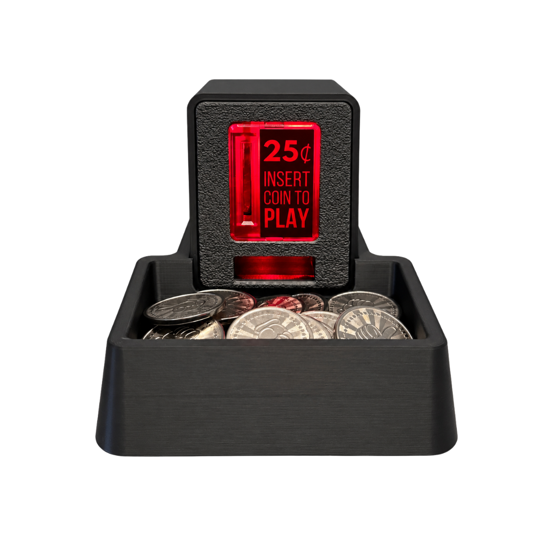 A black coin tray with an Insert Coin Cube sitting on top filled with arcade tokens.
